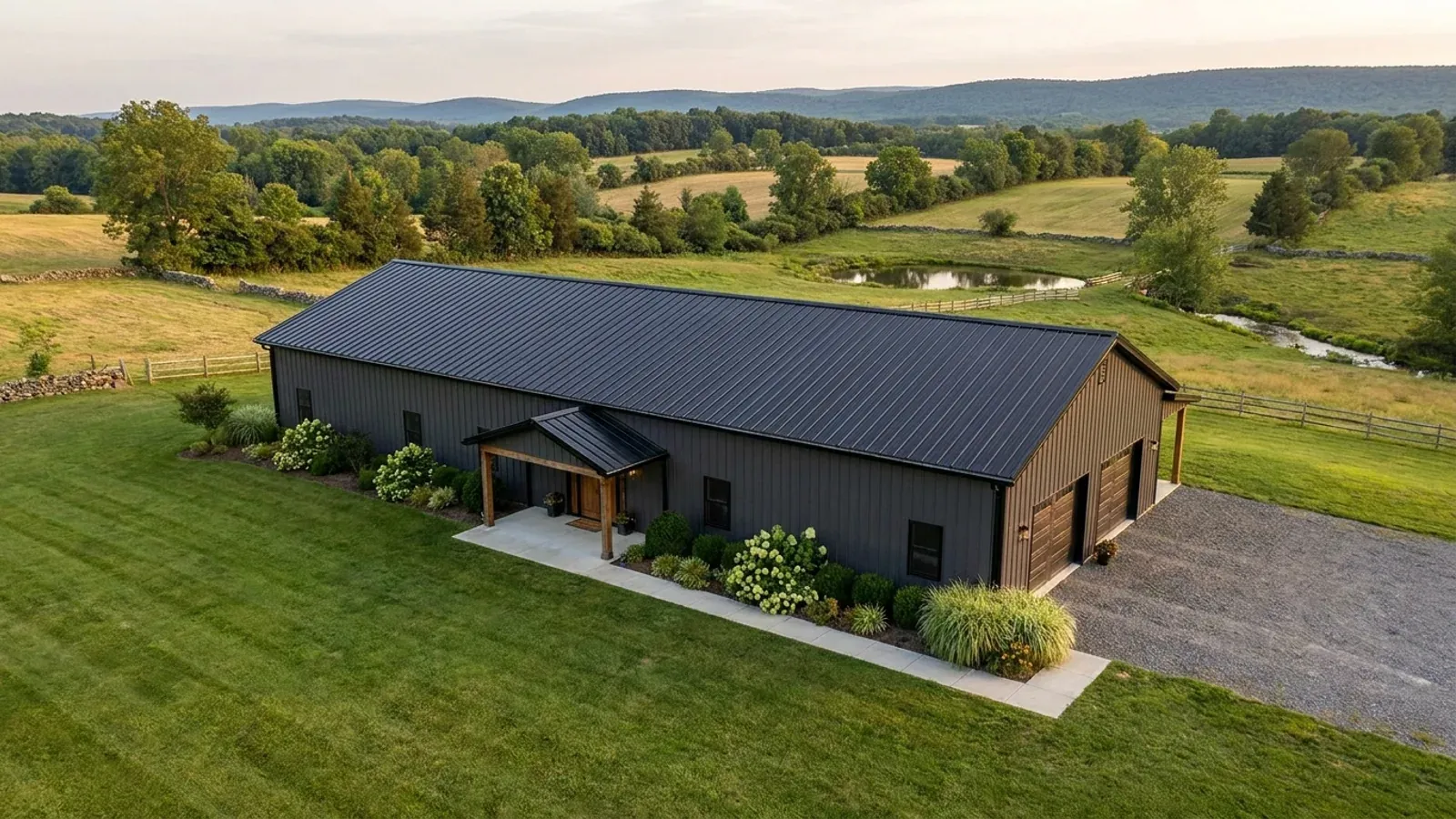 A completed single-story barndominium with a long, low roofline and no upper-level windows.